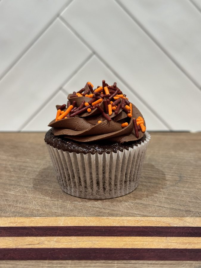 Chocolate Celebration Sprinkles cupcake with maroon and orange sprinkles