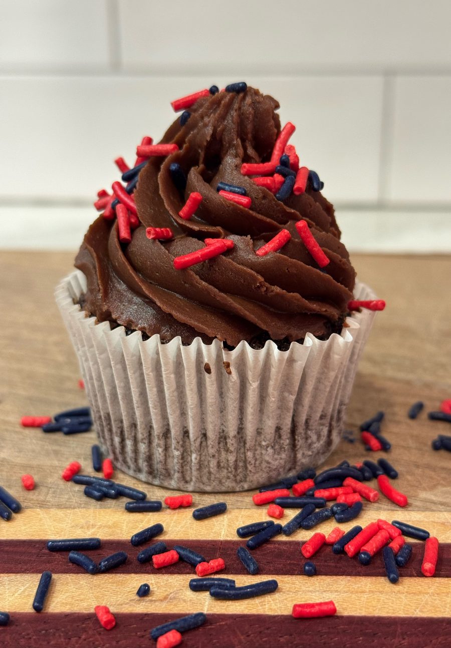 Chocolate Celebration Sprinkles cupcake with red and navy sprinkles